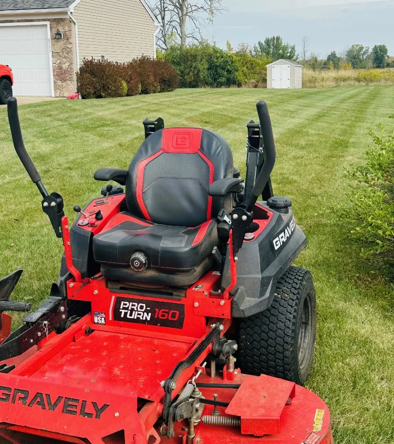Professional lawn mowing service with a Gravely commercial mower